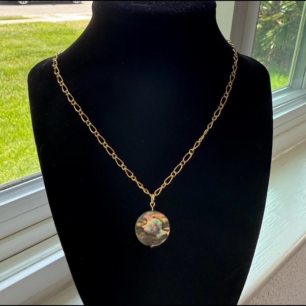 Handmade gold necklace with multicolor pendant.